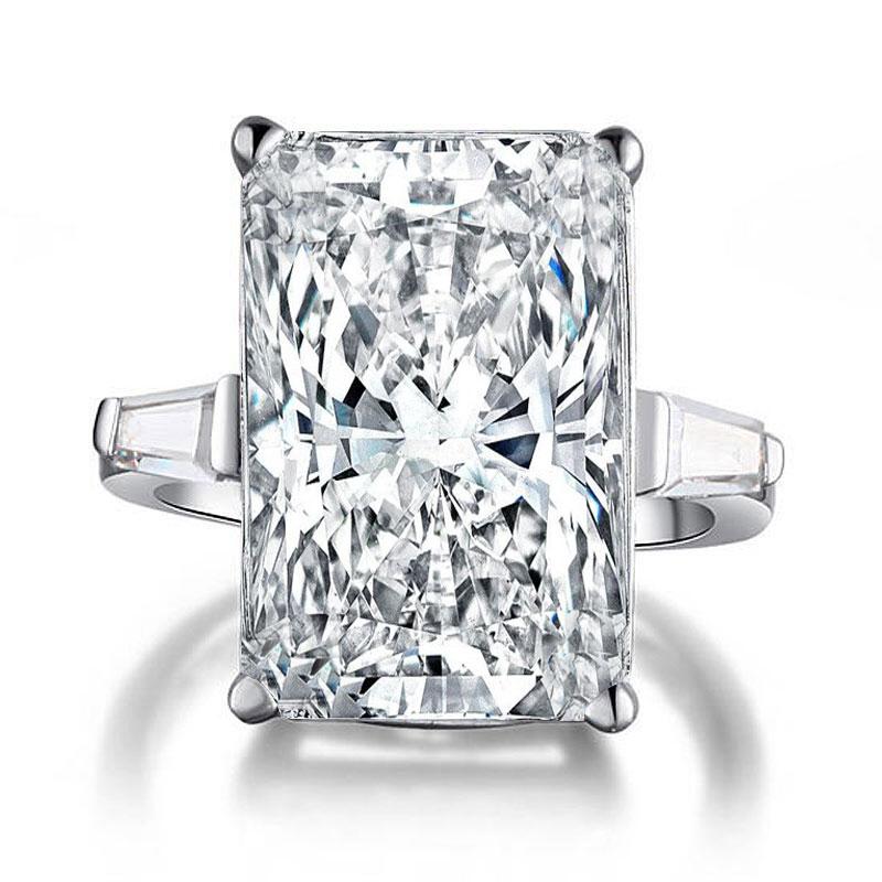 

Italo Three Stone Created White Sapphire Engagement Ring