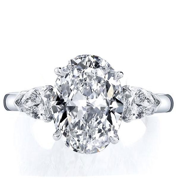 

Italo Three Stone Oval Created White Sapphire Engagement Ring