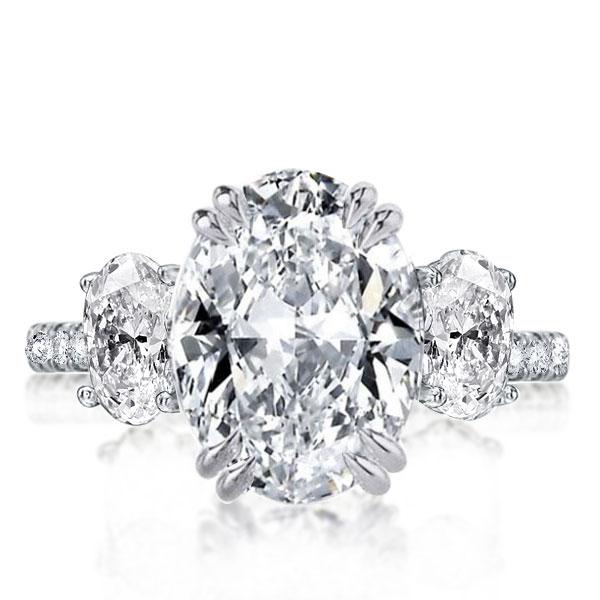 

Italo Three Stone Oval Created White Sapphire Engagement Ring