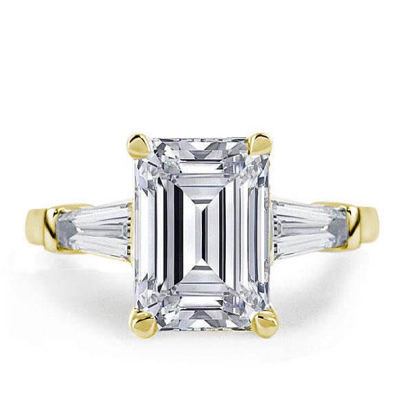

Golden Three Stone Emerald Engagement Ring, White