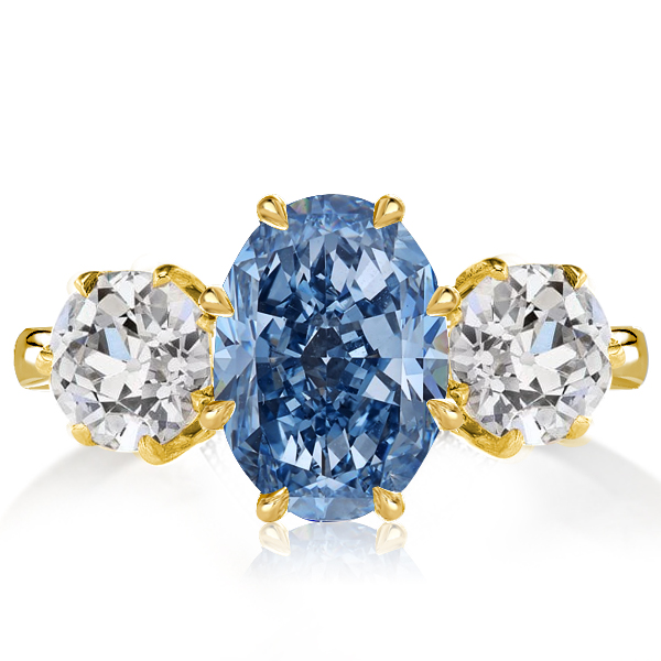 

Italo Golden Three Stone Oval Cut Blue Topaz Engagement Ring, White