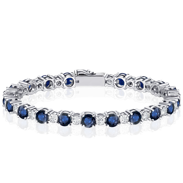 

Round Cut White & Blue Sapphire Tennis Bracelet In Silver