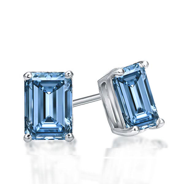 

Emerald Cut Blue Topaz Stud Earrings In Sterling Silver, White