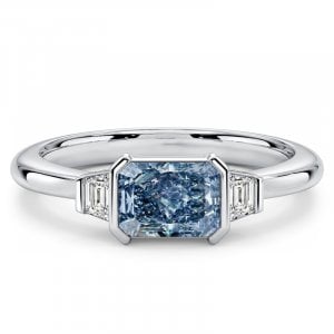 Italo Half Bezel Blue Topaz Radiant Cut Three Stone Engagement Ring