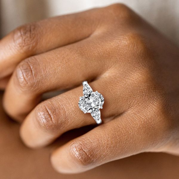 Oval center stone pear side stones deals