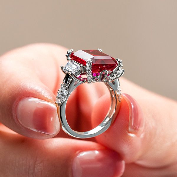 3 stone emerald cut engagement ring