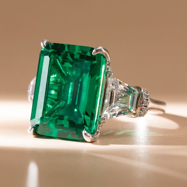 emerald cut three stone engagement ring