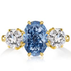 Italo Golden Three Stone Oval Cut Blue Topaz Engagement Ring