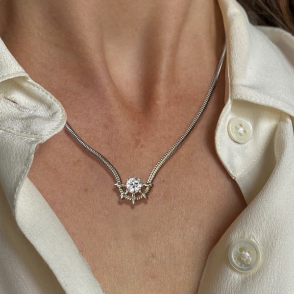 How Can a Tennis Chain Necklace Be Styled with Engagement Rings for Women?